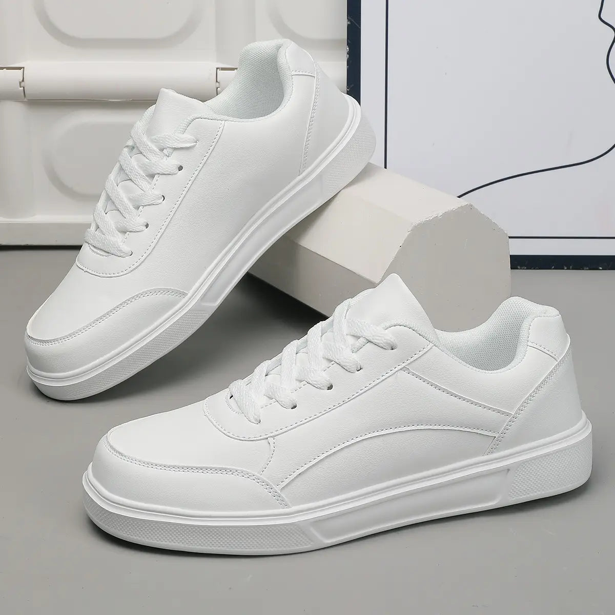 Men white leather minimalist low top sneakers featuring a clean design with matching laces.