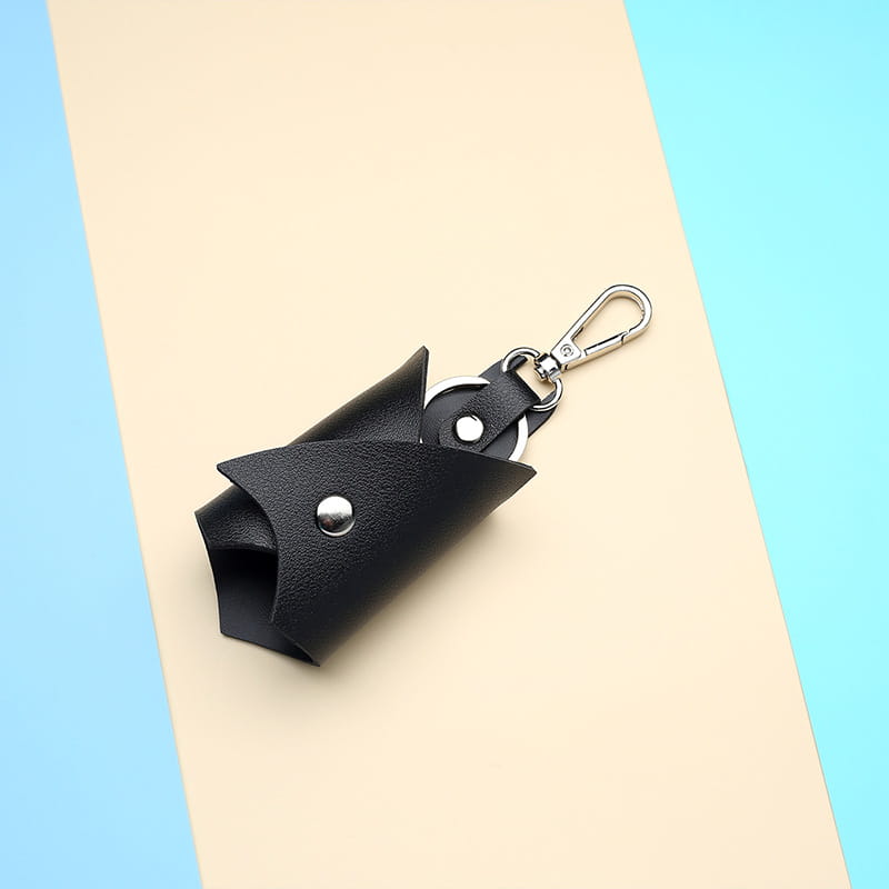 black leather Batman keychain and card holder with silver-toned metal clasp and rivets.