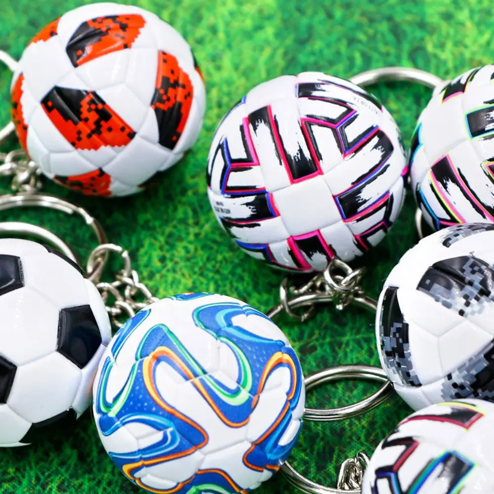 Leather football keychain sports souvenir pendant featuring mini soccer balls in vibrant colorful designs with glossy plastic surfaces and metallic chains.