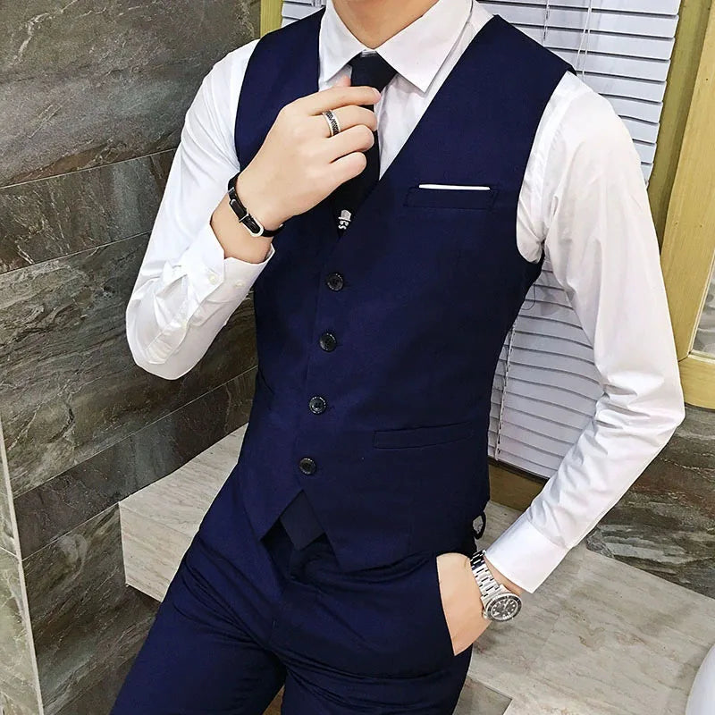 A navy blue slim fit men’s formal suit vest with black buttons and a white pocket square designed for business use.
