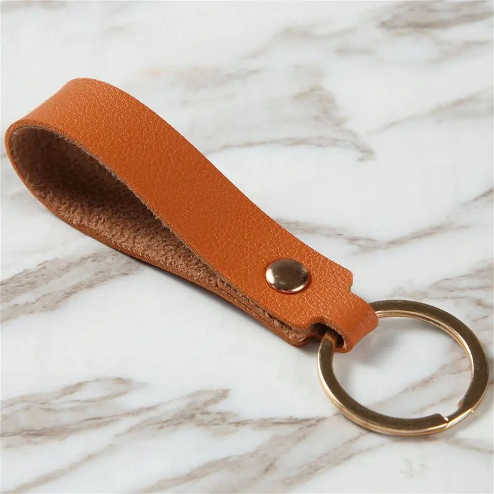 Tan leather keychain with a brass ring and metal snap from the pu leather keychain fashion metal keyring collection.