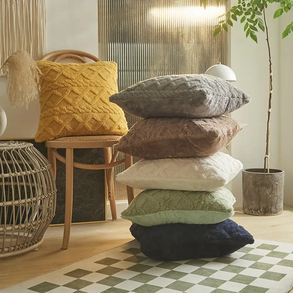 Stack of plush geometric throw pillow covers 45x45cm in cozy textured fabric featuring mustard yellow gray brown cream mint green and navy blue colors.