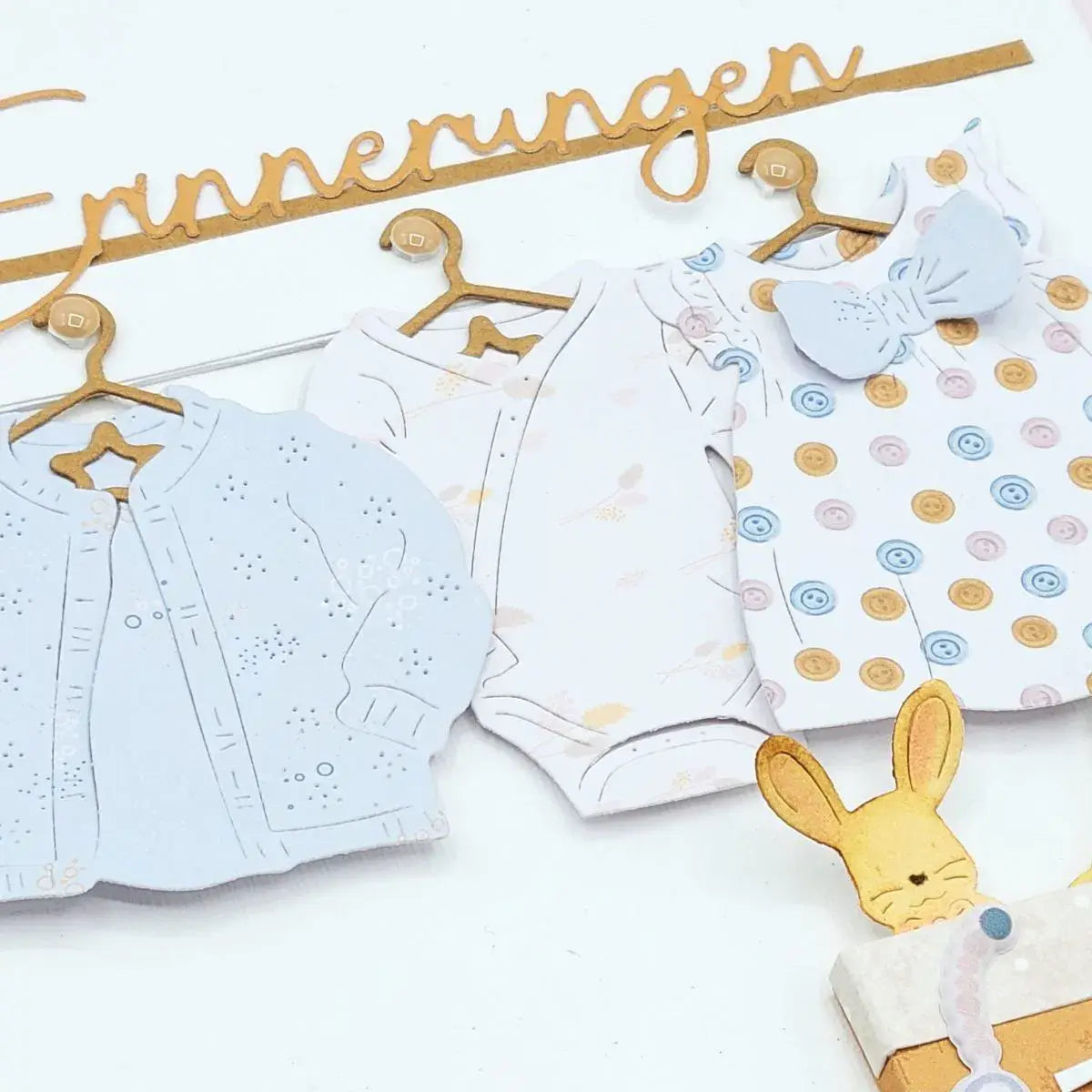 Weiße, ausgeschnittene Babybody-Vorlage aus Papier mit hellblauen und goldenen Punkten für Oster-Ei-Hasen-Babyschneidvorlagen.