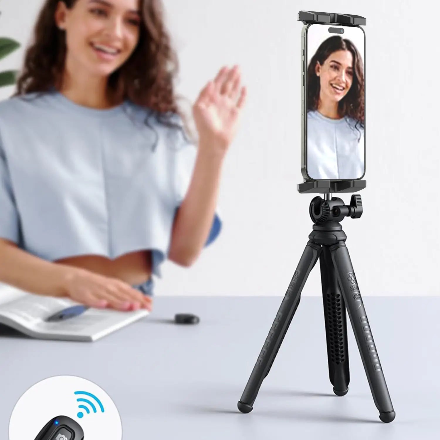 black adjustable length tablet holder tripod with phone mount holding a smartphone for universal use