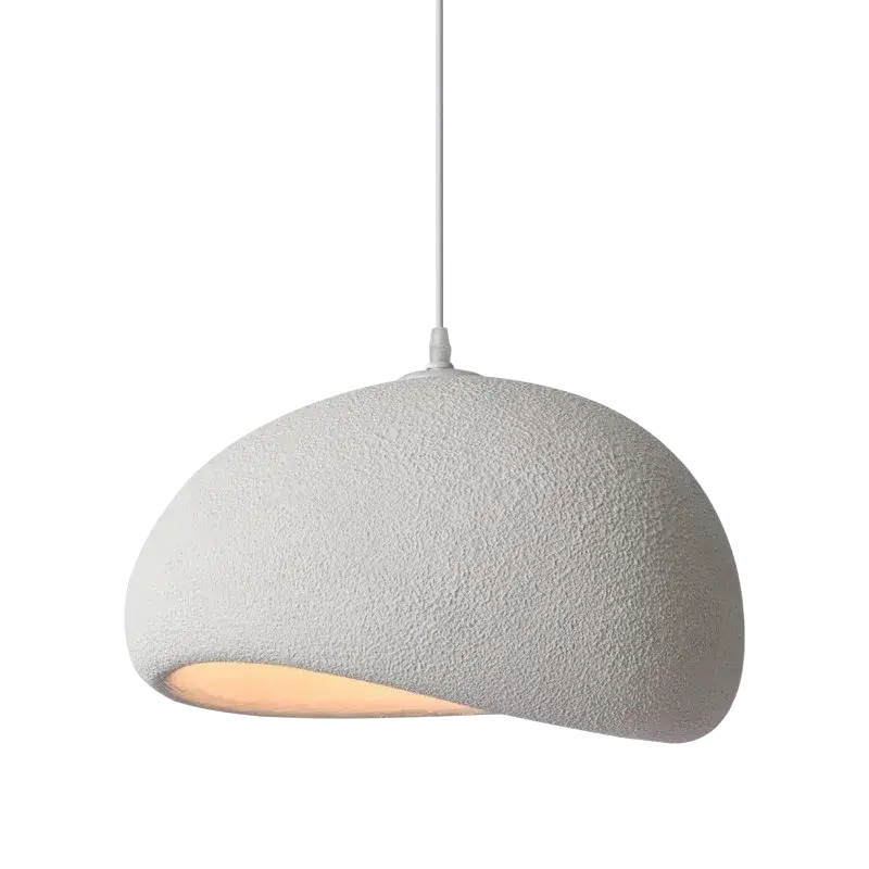 A minimalist white pendant light with a textured dome-shaped shade glowing warmly for living room or dining room use