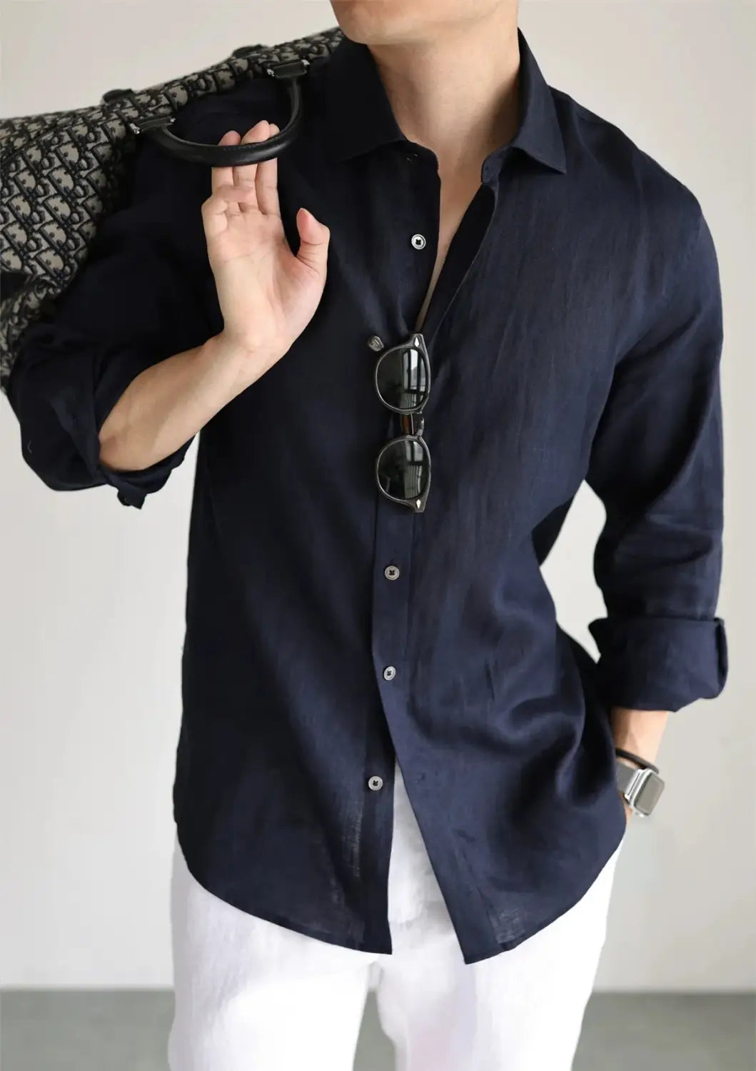 Navy blue men cotton linen casual button down shirt with rolled sleeves and silver buttons.