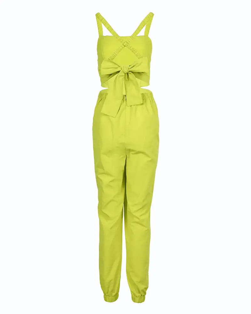 a vibrant lime green women summer printed cutout jumpsuit featuring a cross-back design and a prominent bow at the waist shown from the back side