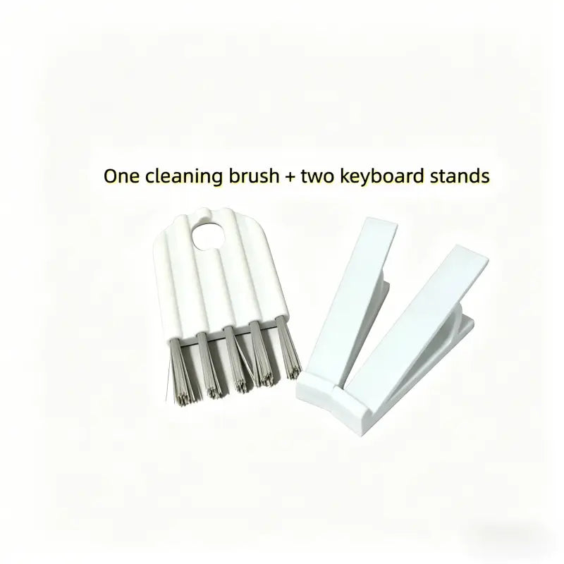 white plastic cleaning brush with metal bristles and two white plastic keyboard stands in a keyboard stand and cleaning brush set for maintenance and support.