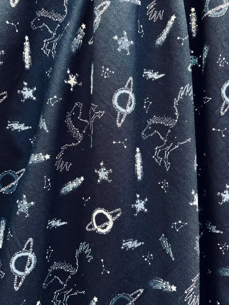 Black vintage cotton dress with whimsical white chalk unicorn and celestial pattern sky full of stars Greta style