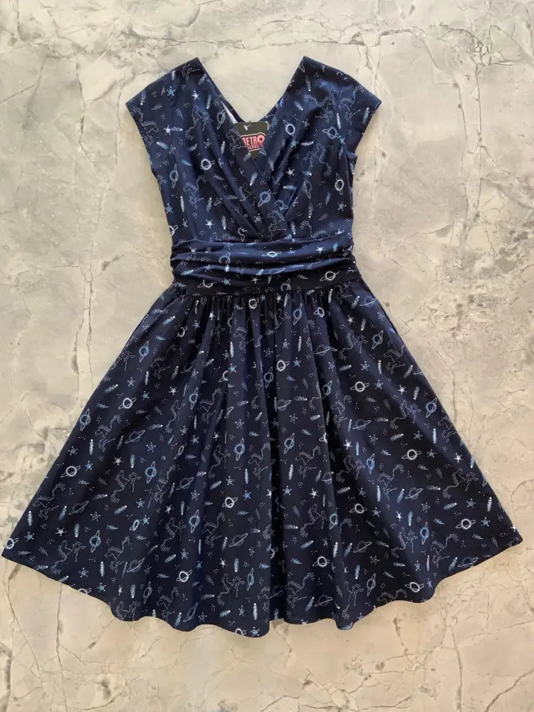 A navy blue sky full of stars greta vintage cotton dress with v-neckline short sleeves and space-themed print