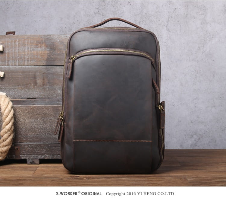 men’s vintage leather backpack in dark brown cowhide featuring gold-toned zippers and detailed stitching.