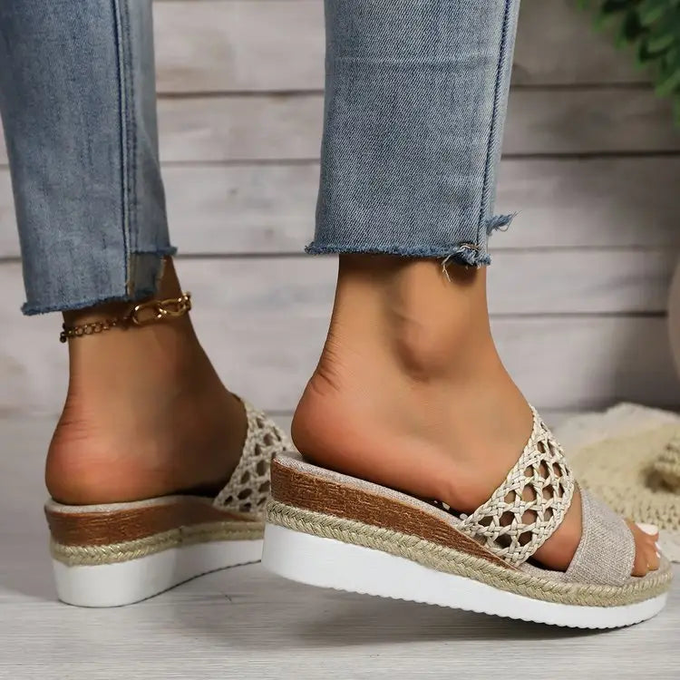 Beige woven espadrille platform wedge sandals for women featuring a white rubber sole and braided jute heel.