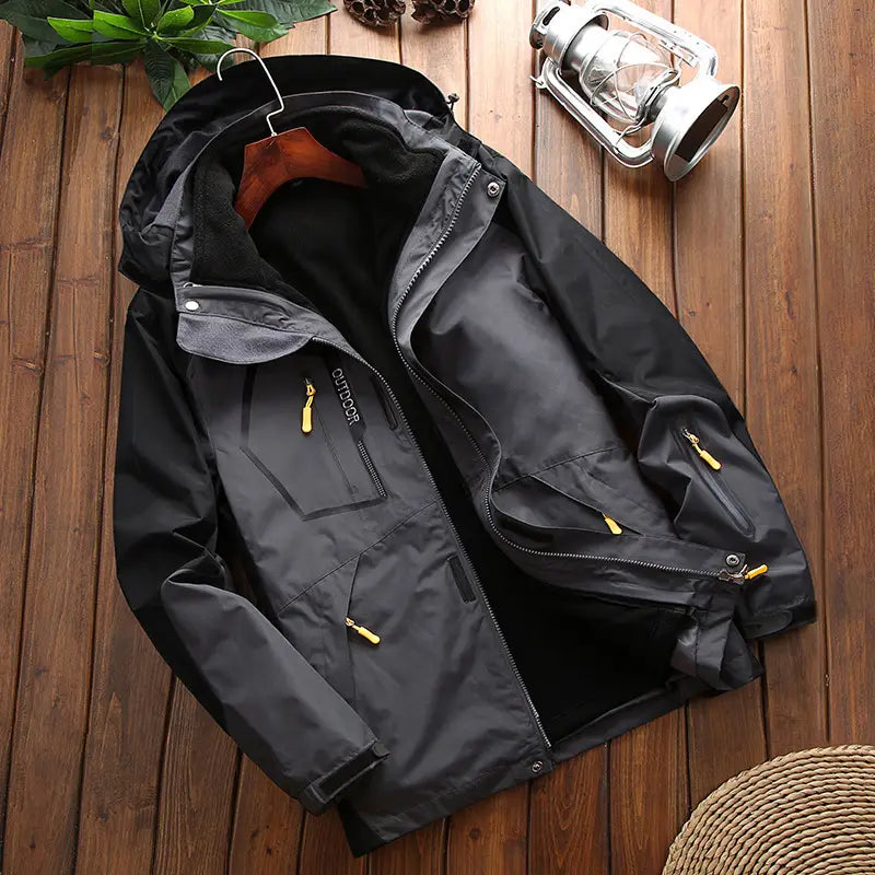 Men three-in-one waterproof winter sportswear jacket in black with yellow zipper pulls and gray inner lining featuring multiple practical pockets.