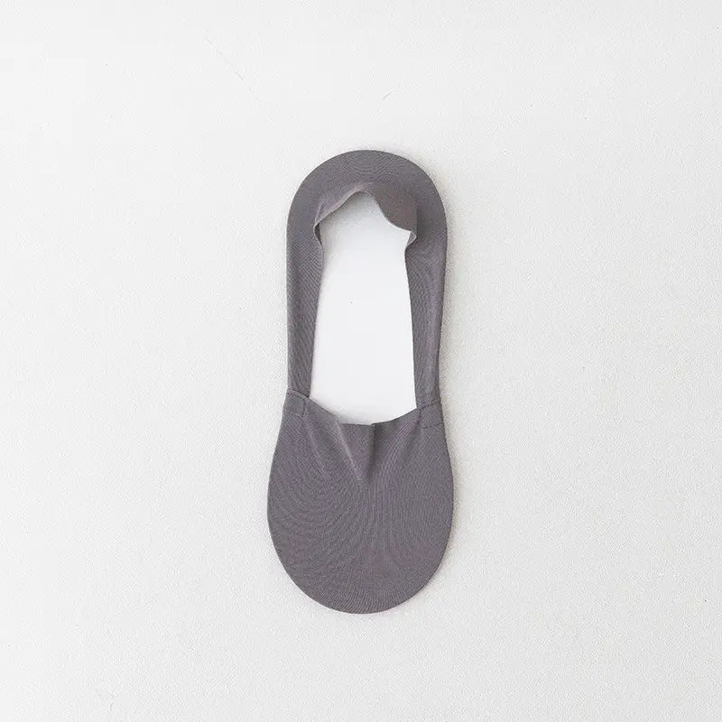 A sleek solid gray men cotton invisible no show sock with a smooth seamless design and subtle texture.