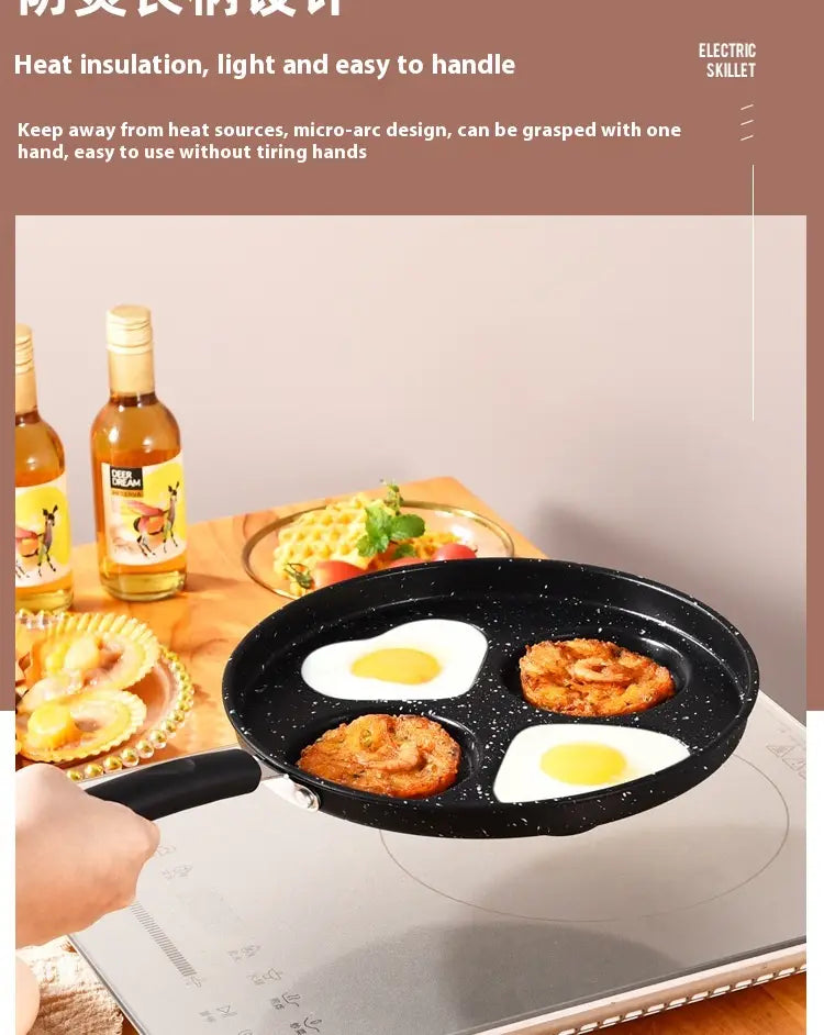 Black speckled non-stick heart pancake pan 25cm made of medical stone with four compartments cooking eggs and fried shrimp in an electric skillet.