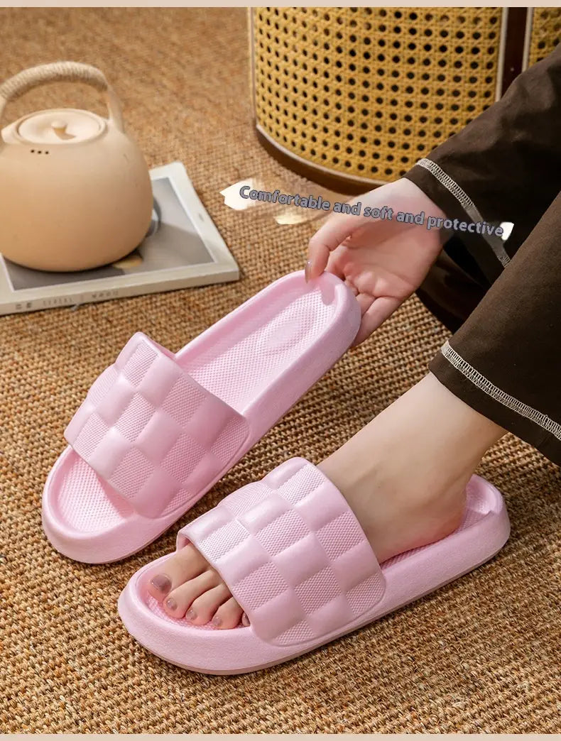Pink rubber slide sandals with a quilted strap design and soft breathable Eva sole for comfortable wear.