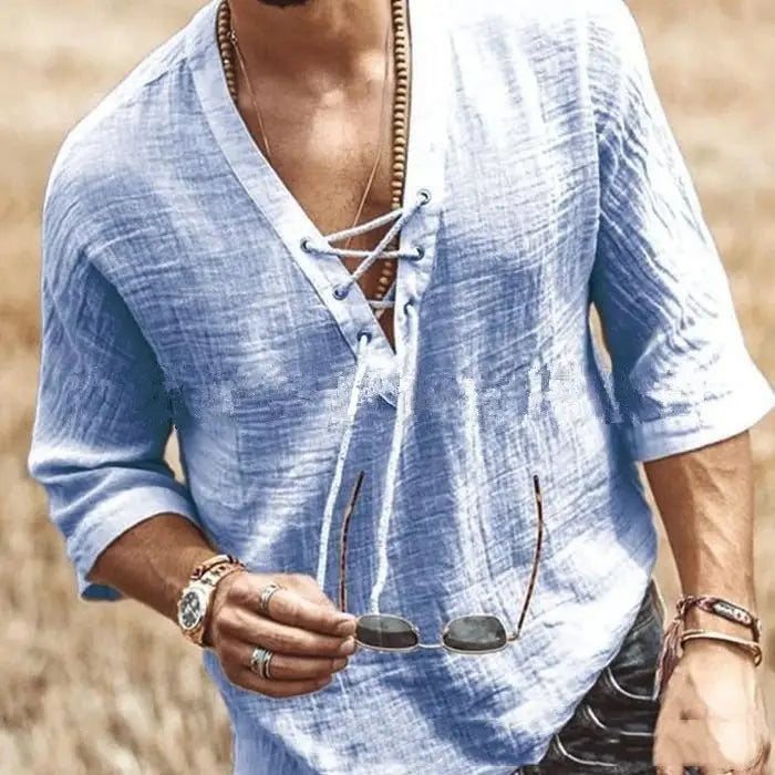 Light blue textured linen shirt with a v-neck and lace up front suitable for casual wear.