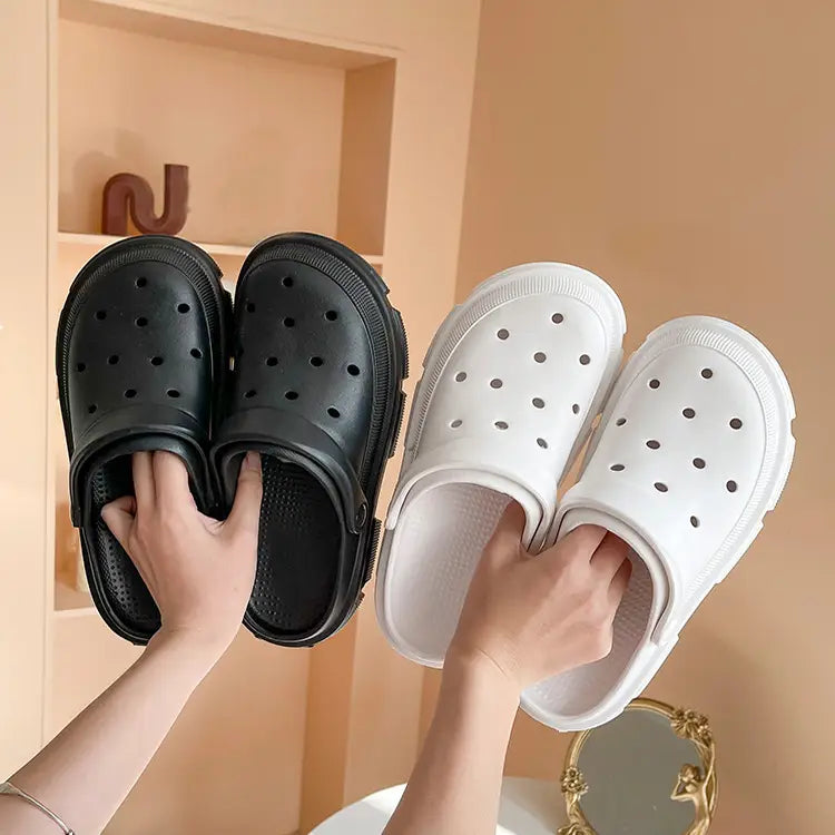 pink rubber unisex lightweight eva garden clogs and beach slippers with thick textured sole and circular perforations
