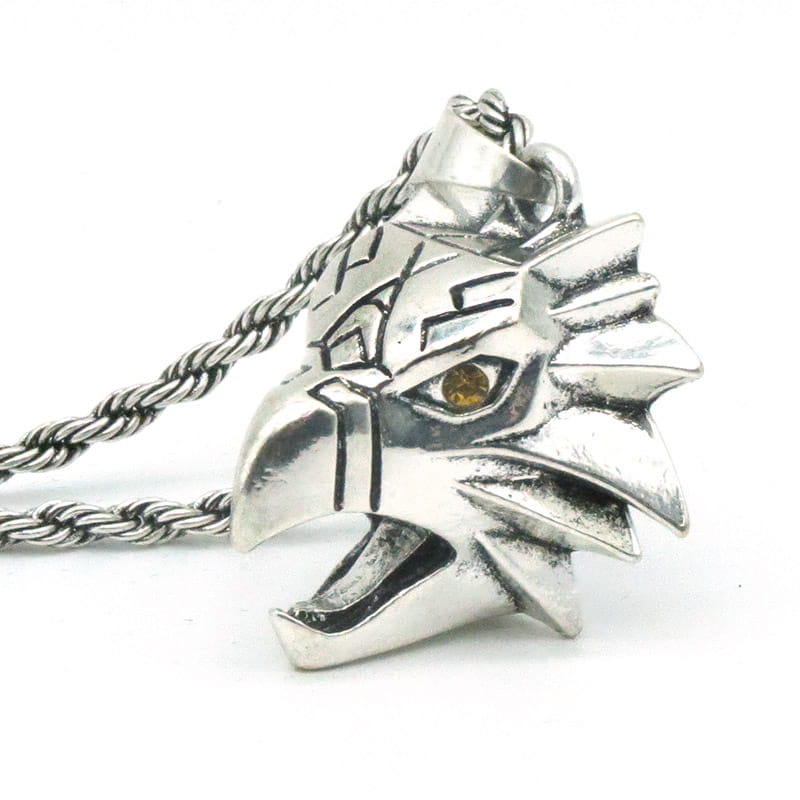 Silver eagle head pendant with yellow gemstone eye on a twisted rope chain geometric wild game animal pendant chain necklace.