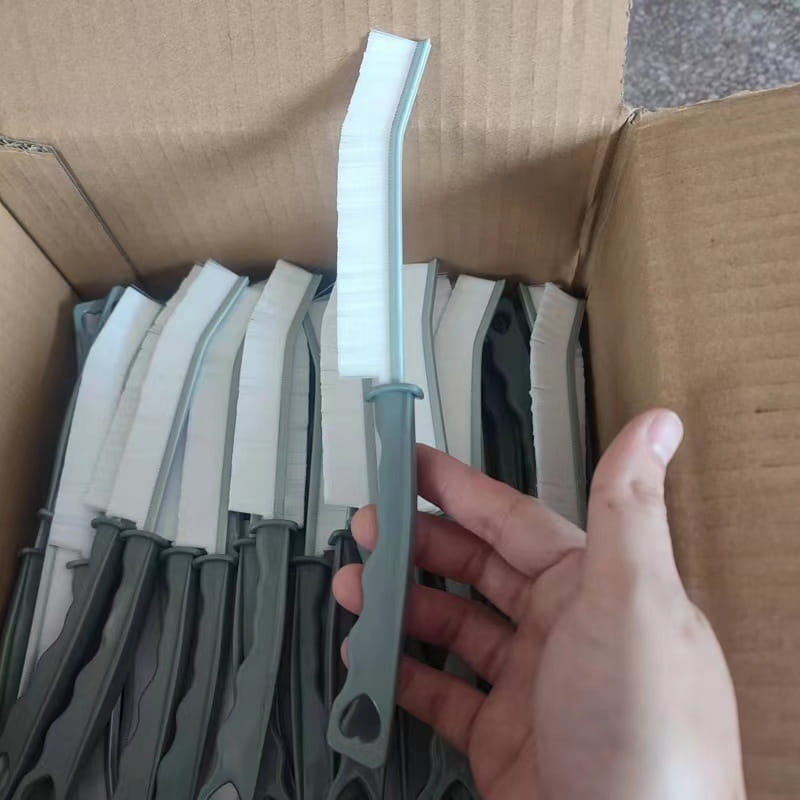 gray plastic-handled gap cleaning brush with white stiff bristle head for tile and crevice cleaning, part of a 5-piece set