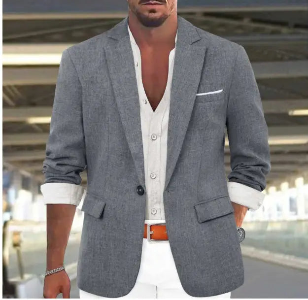 Mens slim fit casual blazer in gray textured fabric with single button closure and rolled-up sleeves showcasing British style suit design.
