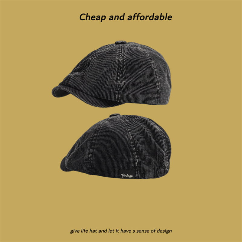 Black corduroy eight panel retro newsboy cap featuring textured ribbed fabric and subtle stitching details.