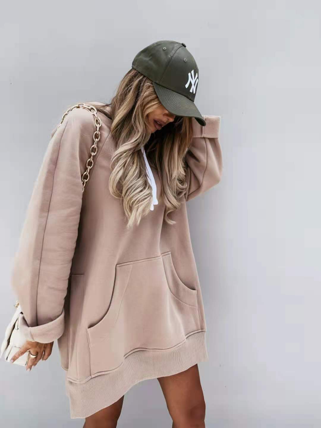 beige oversized mid length hooded sweatshirt dress with front pockets and ribbed hem in soft cotton blend fabric