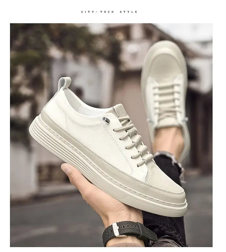 Baskets basses en cuir blanc pour hommes, design sans lacets, avec une semelle épaisse côtelée pour un usage décontracté.