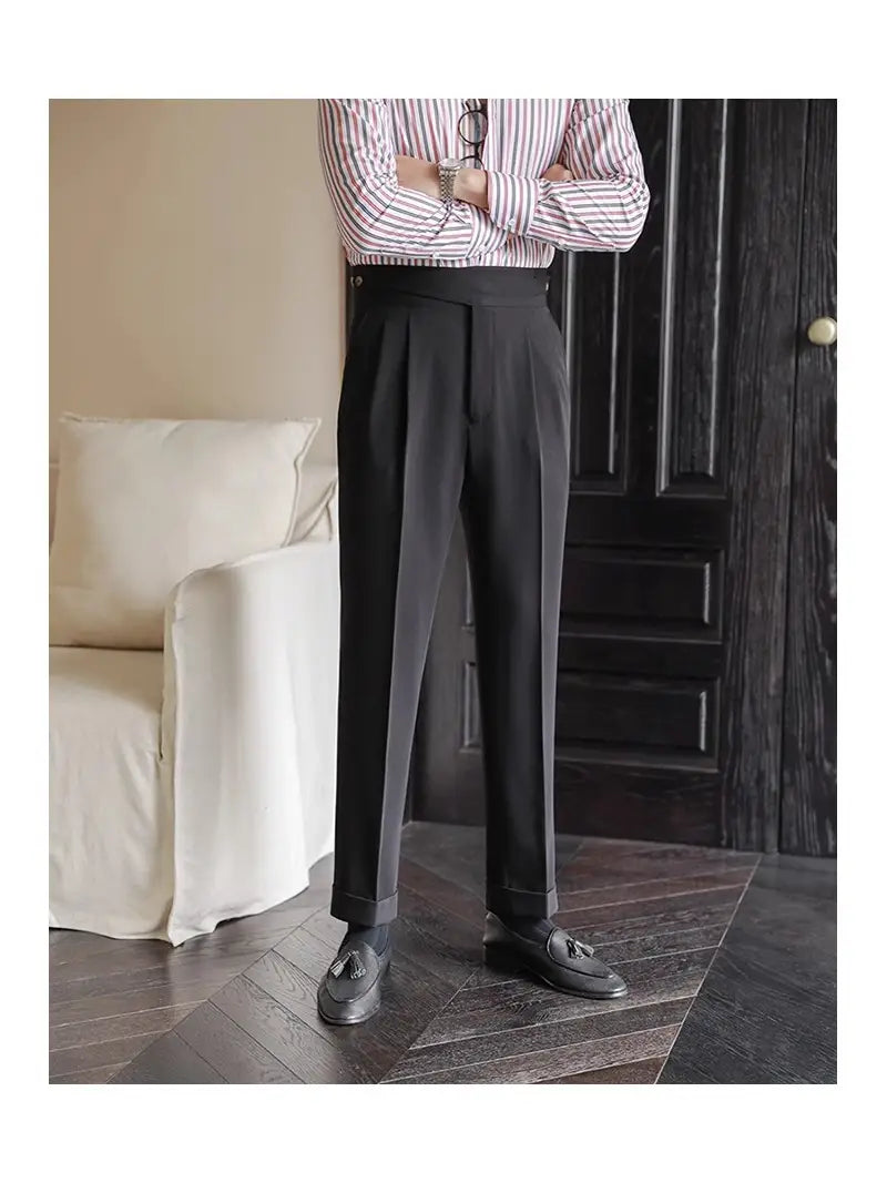 Black tailored pleated wool straight leg trousers featuring a sleek modern cut and subtle pleats at the waist.