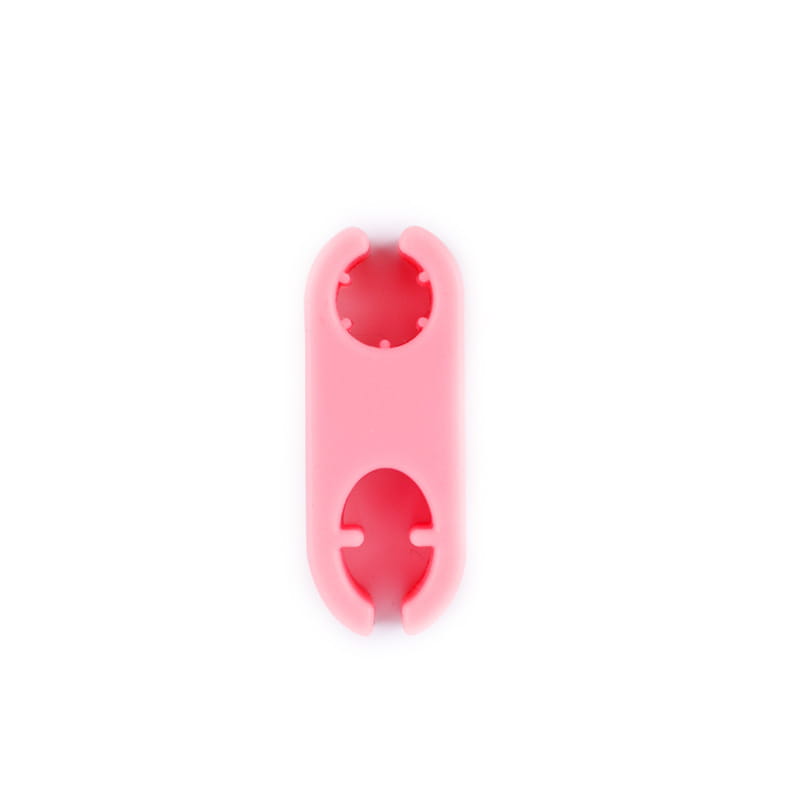 Pink silicone bottle opener with two circular cutouts included in the pet selfie phone clip and dog toy set.