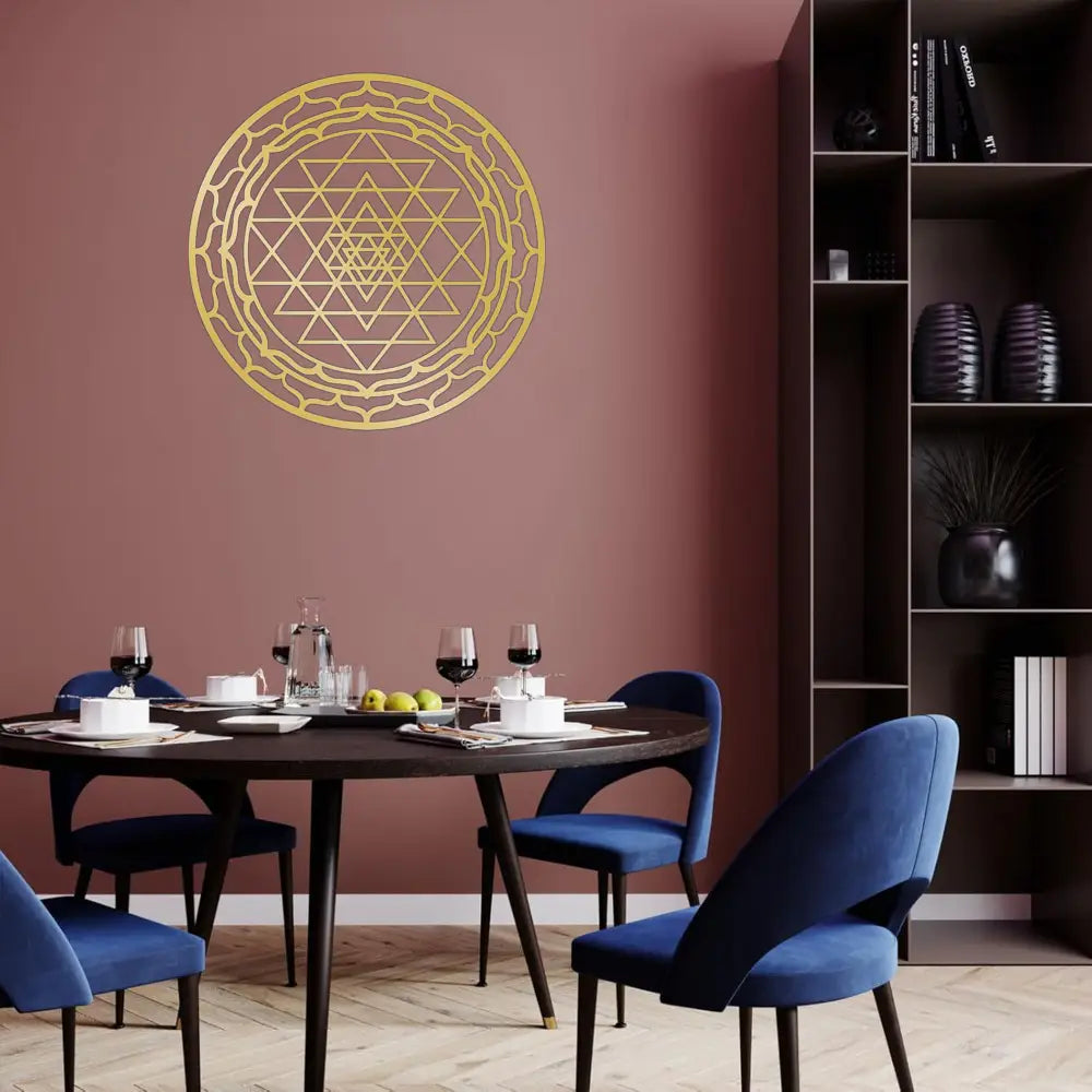 Gold-colored geometric metal wall art featuring intricate triangular and circular patterns in the Sri Yantra sacred geometry design for home decor.