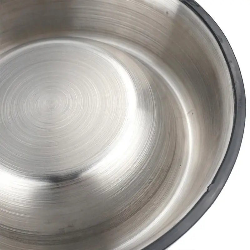 Stainless steel pet bowl with a black non slip rubber base designed for stability and durability.