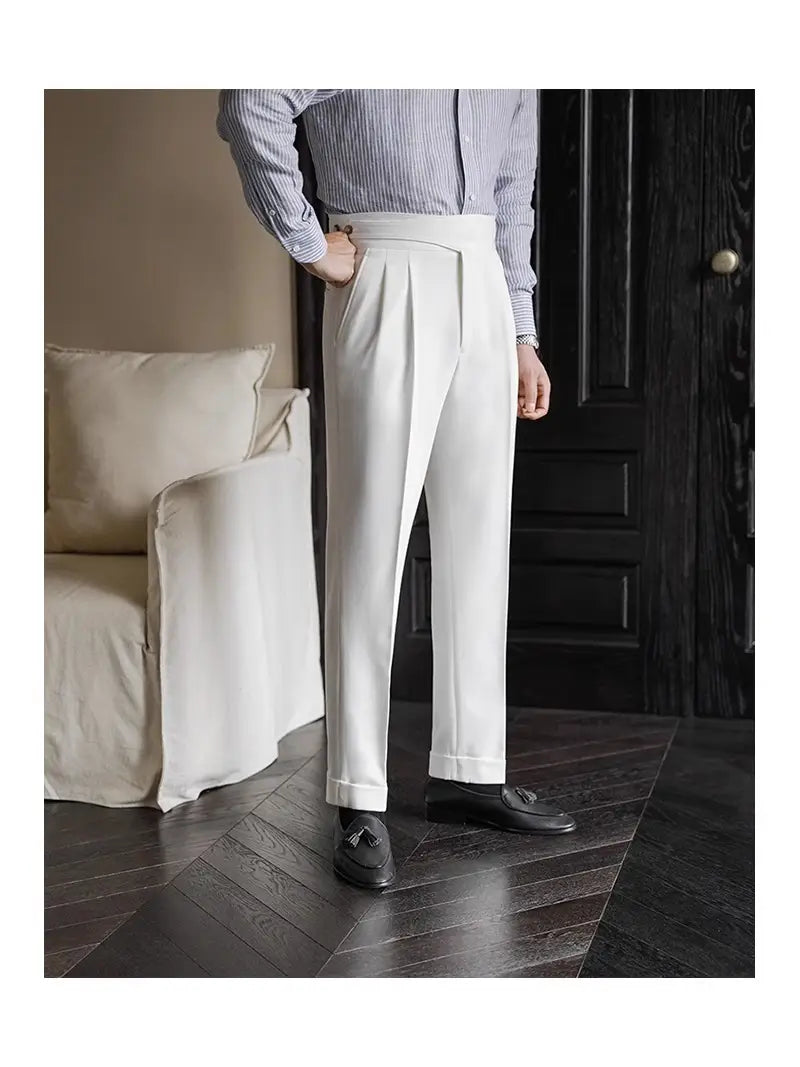Cream-colored tailored wool trousers for men featuring a high waist and pleated straight leg design.