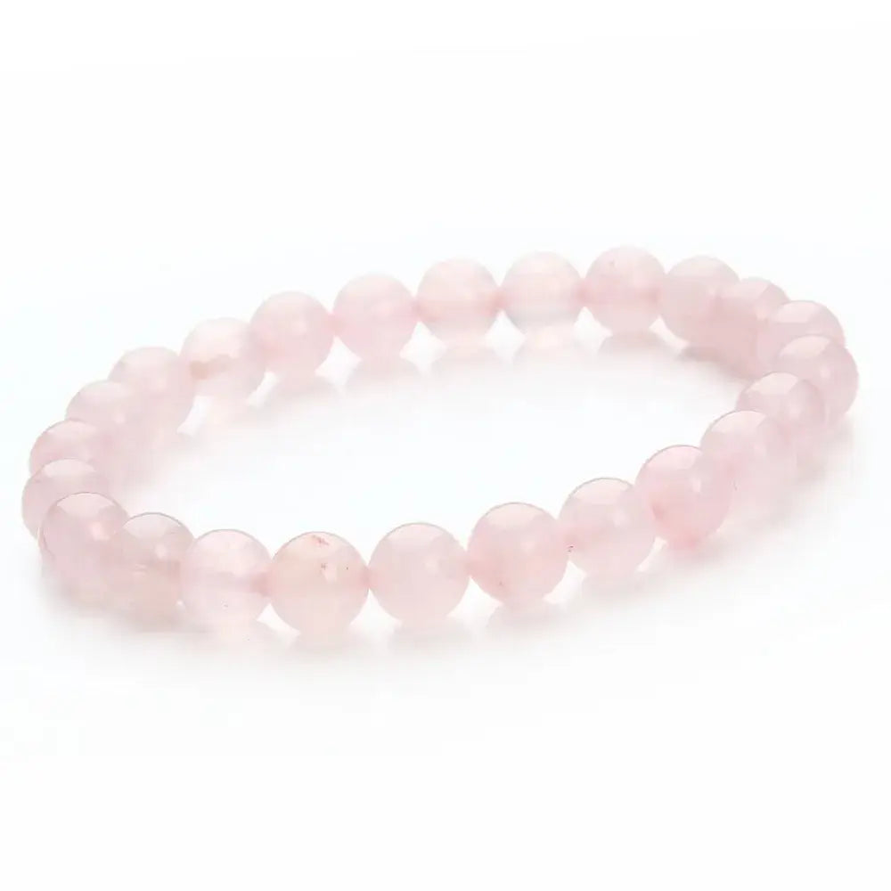 A natural polished gemstone and agate beaded bracelet featuring a delicate pink rose quartz bead design with smooth rounded stones.