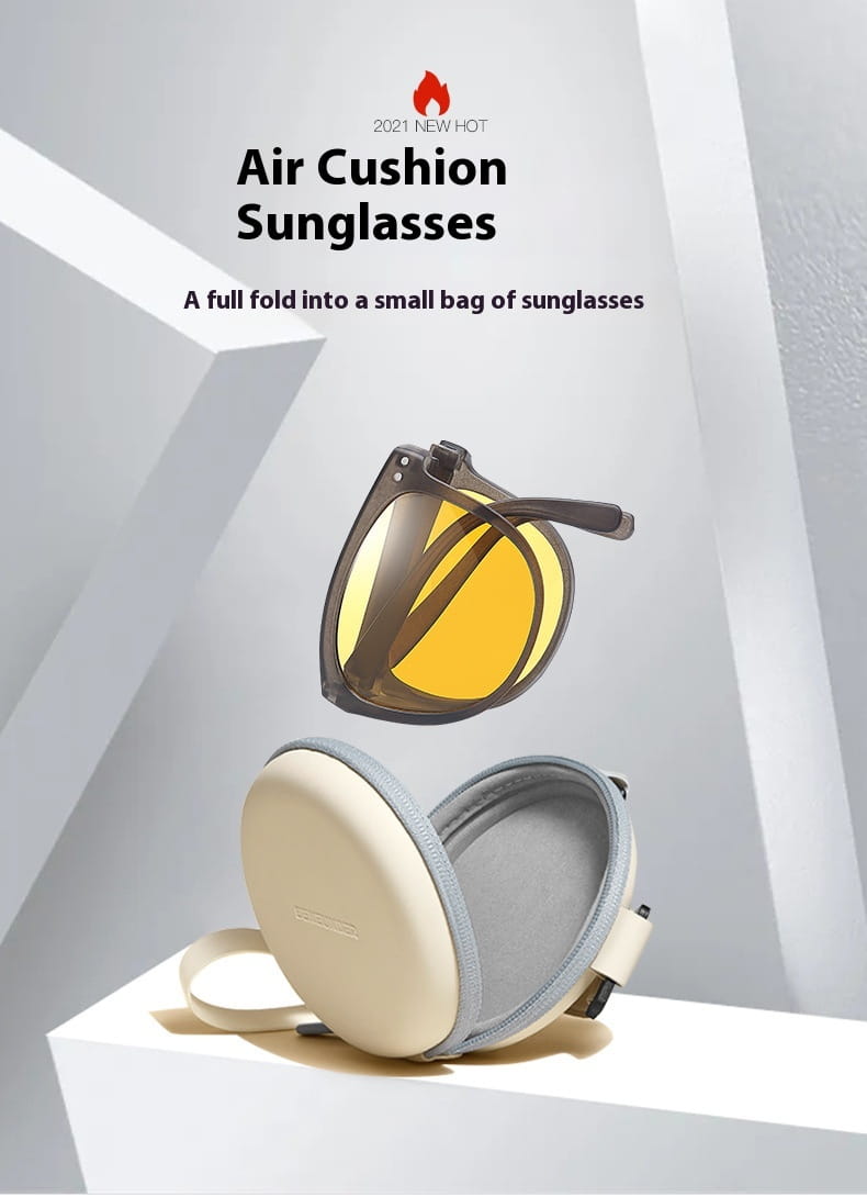Premium polarized folding sunglasses for women featuring yellow-tinted air cushion lenses with dark frames nestled in a cream-colored protective case.