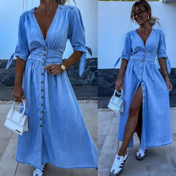A light blue denim midi dress with a button front closure v-neck and puff sleeves tied at the cuffs.