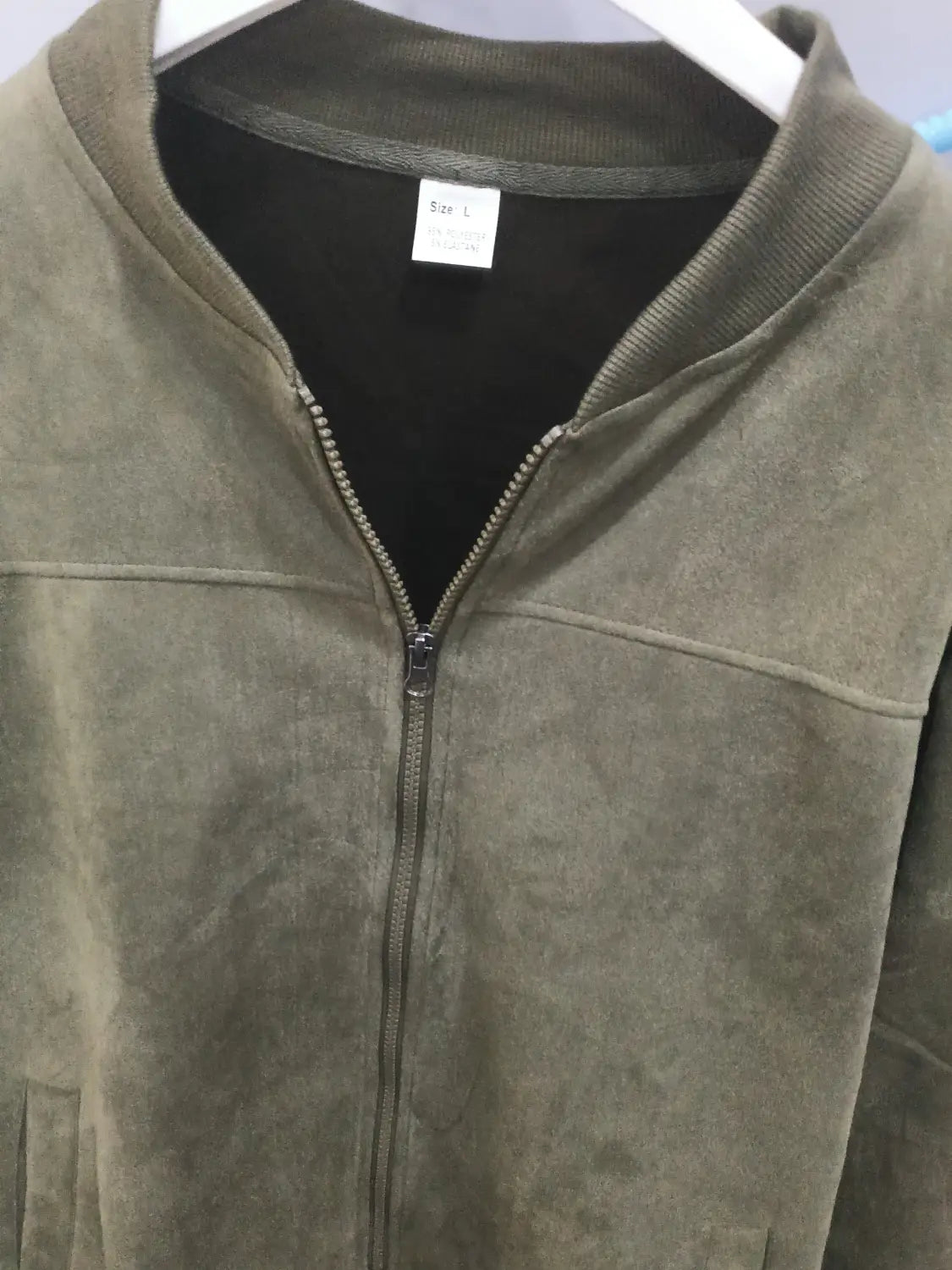 Men suede casual retro jacket in olive green suede with black inner lining and silver zipper.