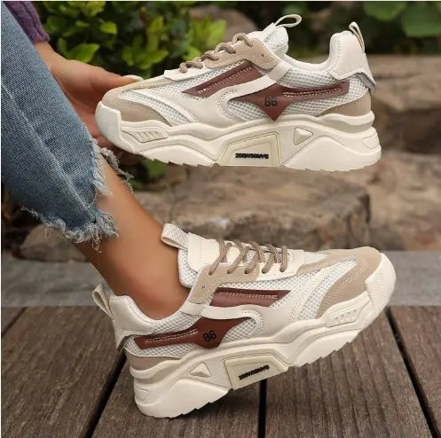 Womens mesh platform sneakers in cream and taupe with breathable mesh, synthetic leather accents, and a thick rubber sole.