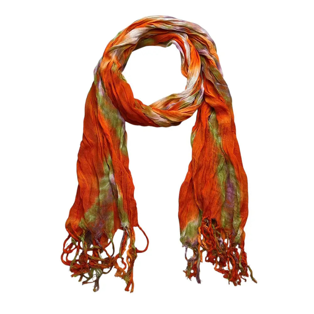 Ein kräftiger Orange-, Grün- und Lila-Viskoseschal mit leichtem Batik-Print und Fransenenden, geeignet als Kleiderschal.