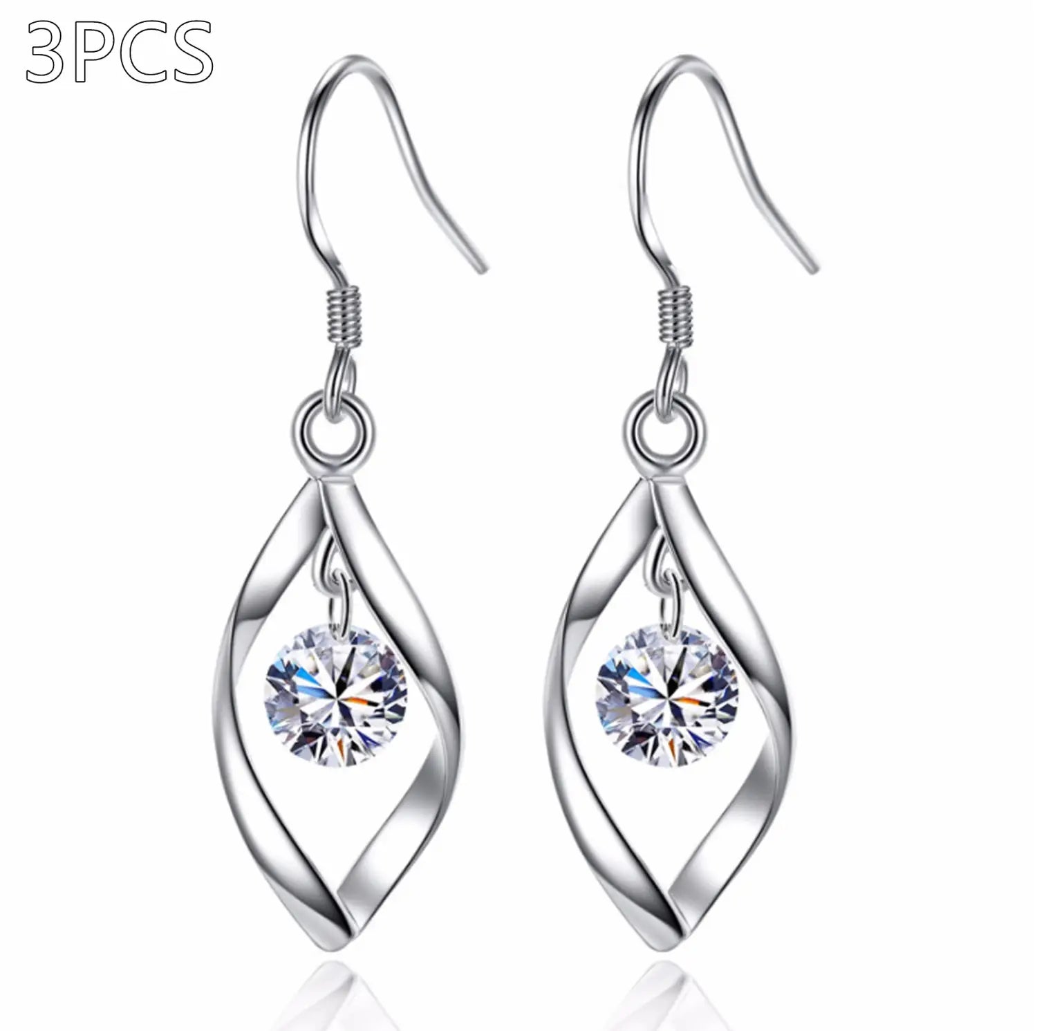silver teardrop-shaped earrings with twisted metal design and clear faceted crystal dangling at the center