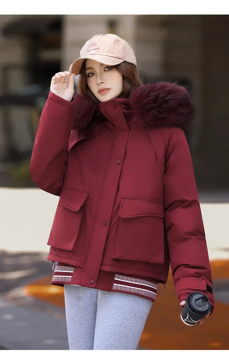 Maroon faux fur collar puffer jacket featuring a plush burgundy fur-lined hood and striped cuffs.