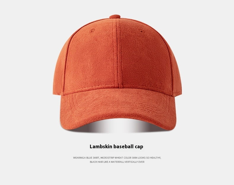 A soft rust-orange suede baseball cap with a minimalist six-panel design and curved brim adjustable for comfort.