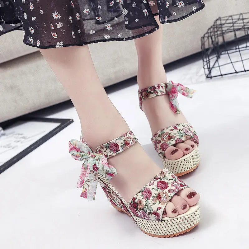 floral bohemian platform wedge sandals with floral pattern, woven soles, and tied ankle straps