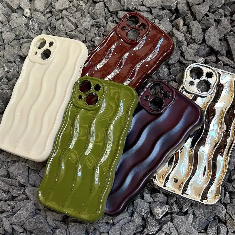 Set of five glossy ceramic wavy liquid silicone iPhone cases in cream olive green burgundy and metallic gold showing the back side with textured surfaces.