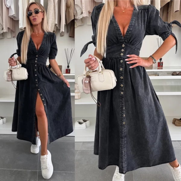A cream-colored structured handbag with a top handle and front flap closure paired with a button front denim midi dress with puff sleeves.