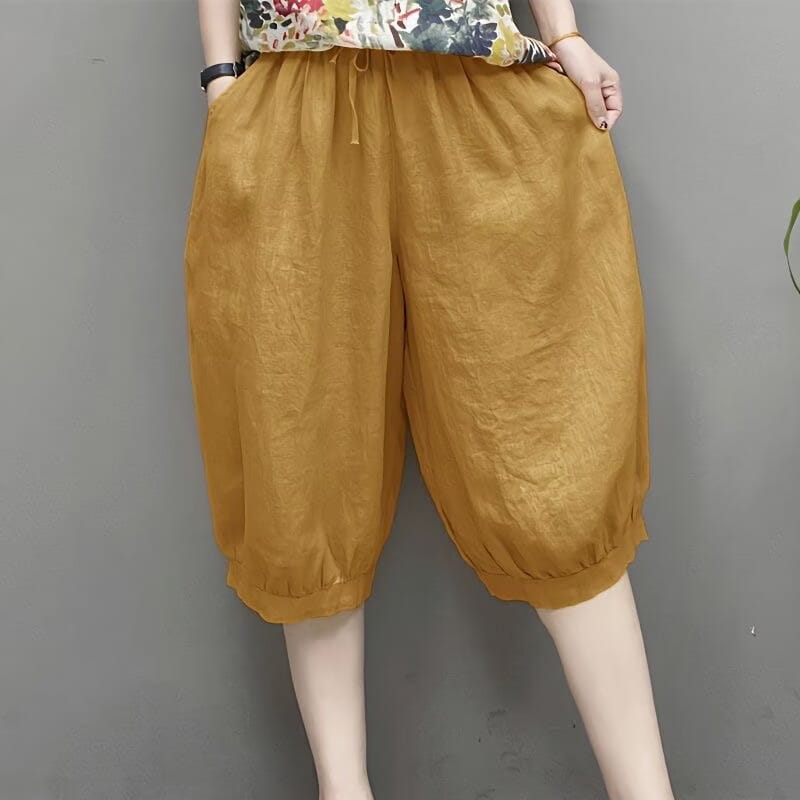 pantalones capri de lino estilo harén de talla grande con tono dorado, con ajuste holgado, pretina ajustable con cordón y puños elásticos.