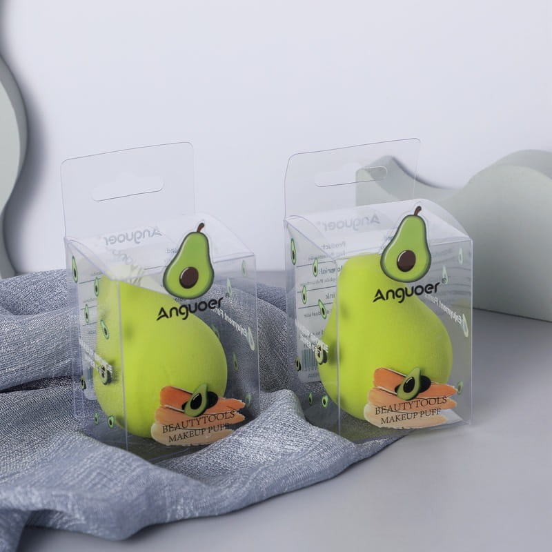 Bright green hydrophilic avocado-shaped makeup puff in clear packaging branded Anguoer from the makeup sponge set hydrophilic beauty blender kit.