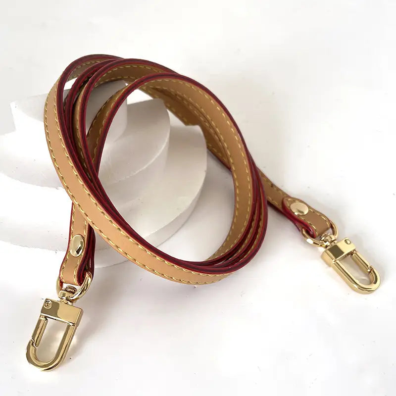 Leather replacement strap for crossbody bags featuring a dual-tone leather design in tan and burgundy with gold-toned metal hardware.