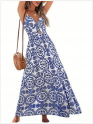 a flowing blue and white patterned maxi dress with a halter neckline combining floral knotted v neck and spaghetti strap design.