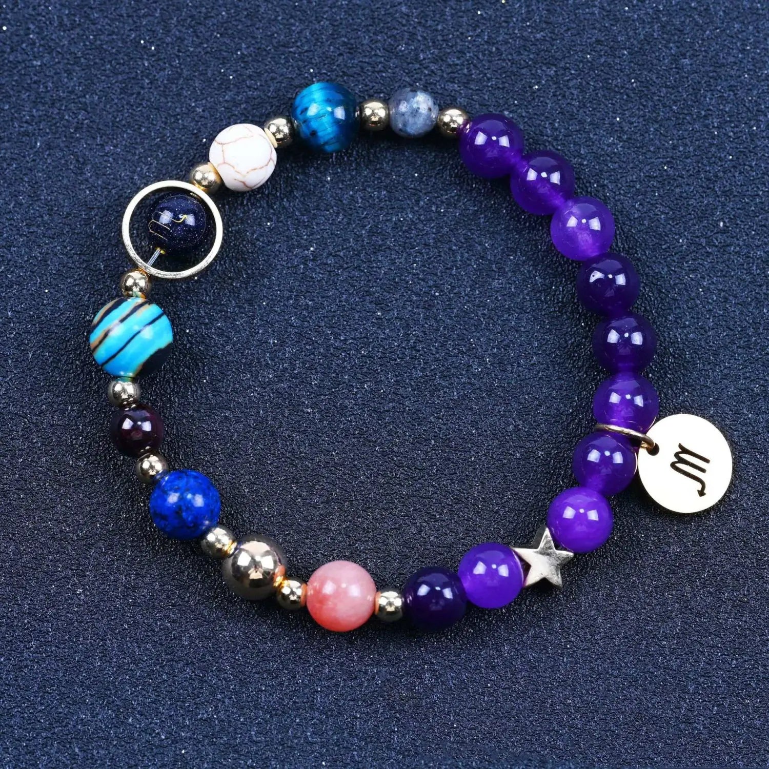 A colorful natural amethyst and agate twelve zodiac beaded bracelet featuring purple blue and pink stones with metallic accents and a silver scorpio zodiac charm.